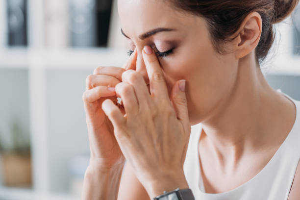 istock attractive tired businesswoman having headache 1056678626