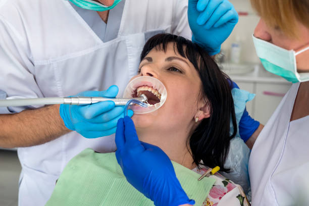istock Dentist working with patient in chair, dentistry 1056681864
