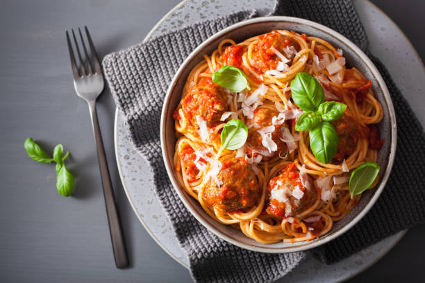 istock spaghetti with meatballs and tomato sauce, italian pasta 1056681942