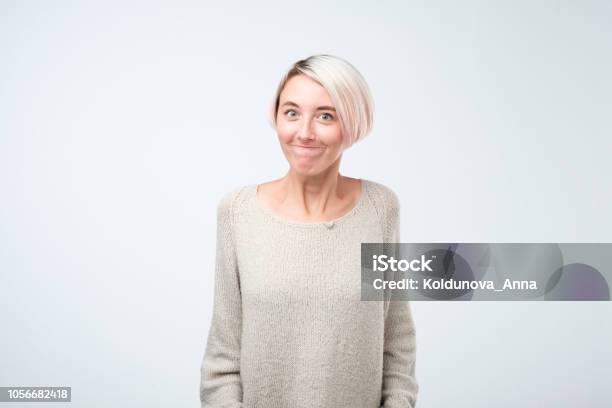 Young Very Unhappy Woman Trying To Look Sorry Or To Complain Stock Photo - Download Image Now