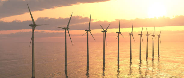 istock Offshore wind turbines against a sunny sky 1056683026