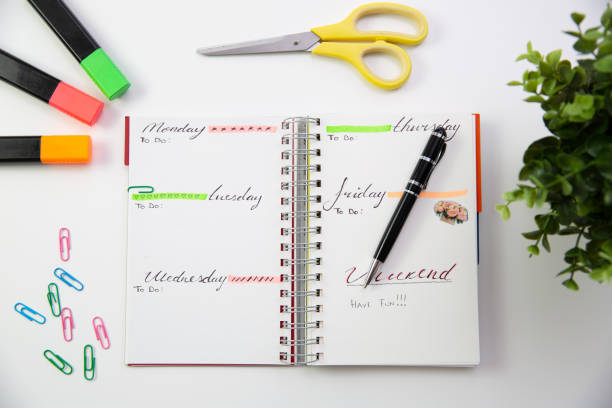 istock Pen on a self made planner. Modern office desk. Working, writing concept 1056683332