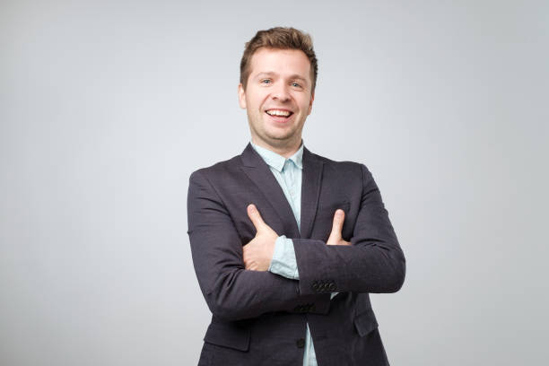 istock Caucaisan man in a suit folded his hands together 1056684024