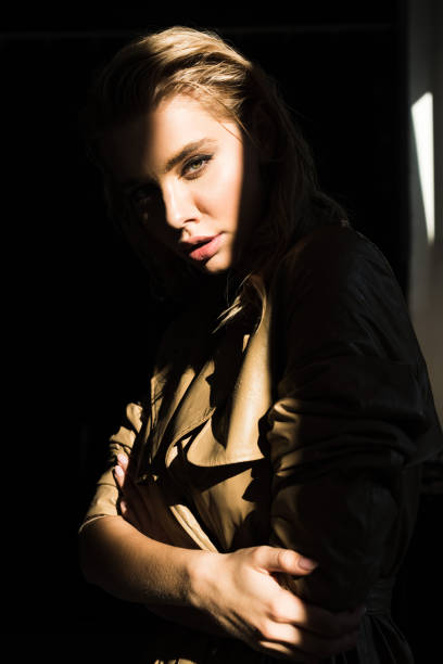 istock side view of beautiful and stylish model looking at camera 1056686710