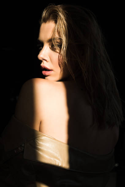 istock side view of beautiful and stylish model looking at camera 1056687014