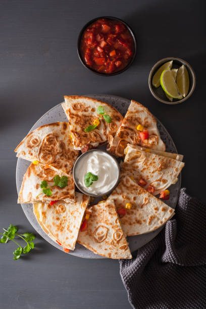 istock mexican quesadilla with chicken, tomato, sweet corn and cheese 1056688604