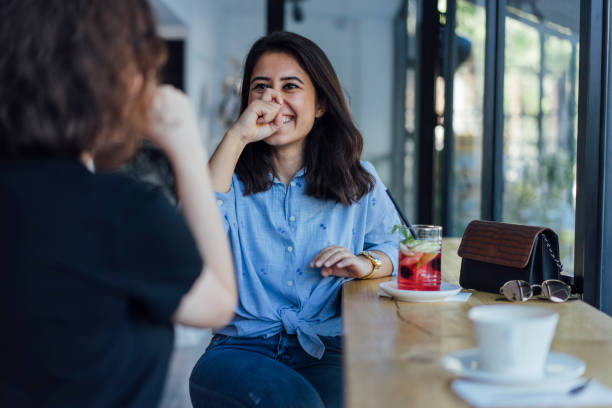 istock Two young woman speak in sign language 1056692192