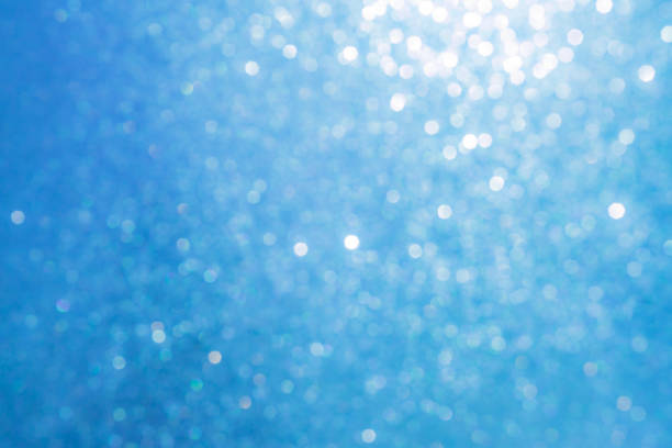 istock Sparkled glitter abstract texture. Beautiful christmas background in light blue colors. Defocused 1056694618