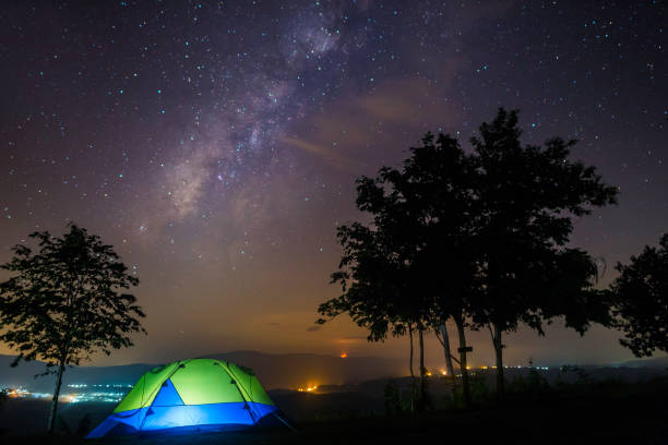 istock Camping tent under milky way at night 1056694816