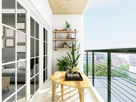 El diseño abierto balcón moderno, mesa de café y verde de las plantas en el balcón es muy cómoda photo