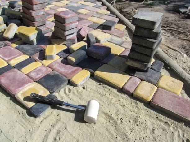 istock Beautiful construction background - in the process of laying paving slabs, unfinished work 1056699166