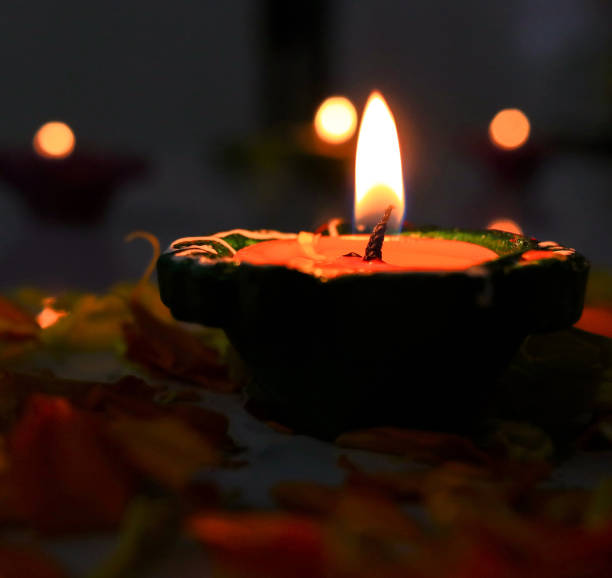 istock Lamp/Diyas lit and arranged for diwali celebration 1056699482