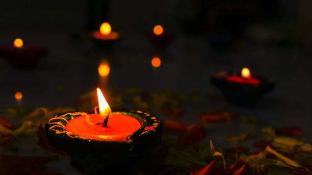 istock Lamp/Diyas lit and arranged for diwali celebration 1056702256
