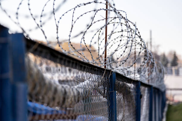 istock Fence with barbed wire. Forbidden to enter 1056704028