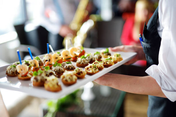 istock Waiter carrying plates with meat dish 1056706010