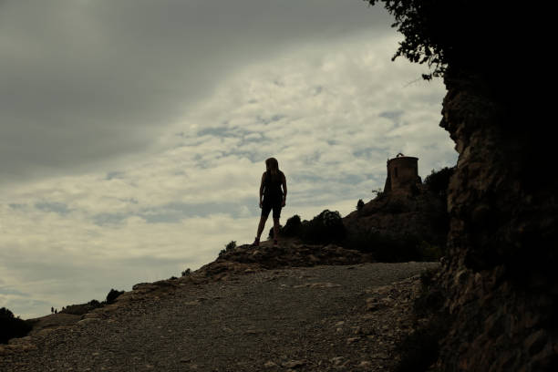 istock woman's silhouette on a mountain 1056708422
