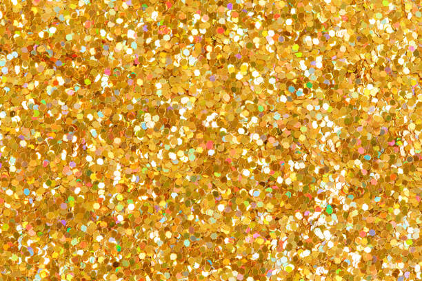 istock Orange glitter texture Christmas background. Bright golden glitter. 1056709672