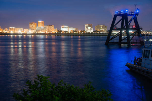 istock Dock Pilings Shine Blue Mississippi River Flowing By Baton Rouge 1056710320