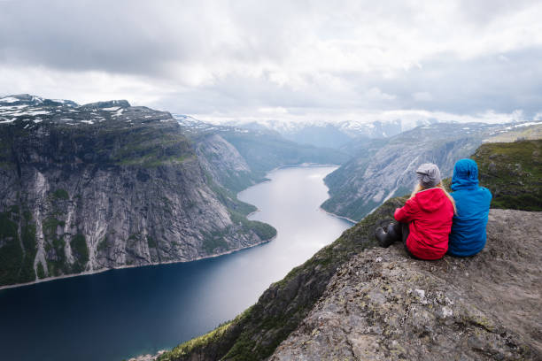 istock Trekking to Trolltunga cliff with view on Ringedalsvatnet lake, Norway 1056717592