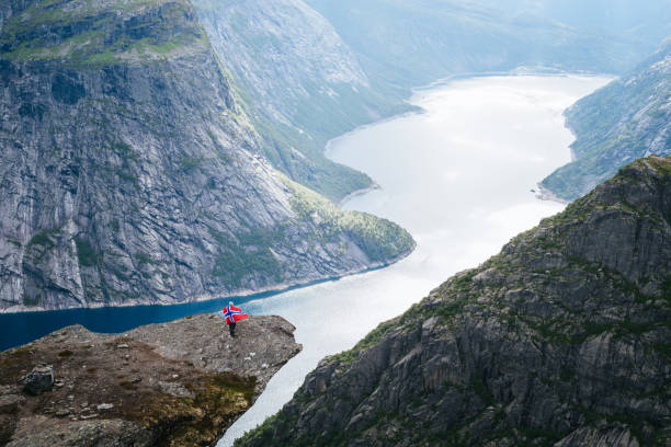 istock Hiking to Trolltunga cliff with view on Ringedalsvatnet lake 1056718090