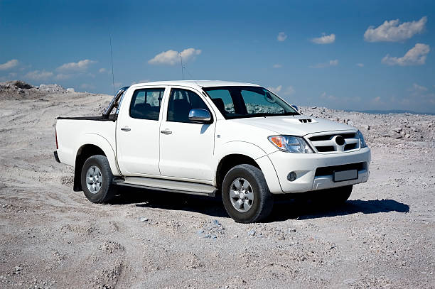 Pickup Pickup truck on white sand. 4x4 photos stock pictures, royalty-free photos & images