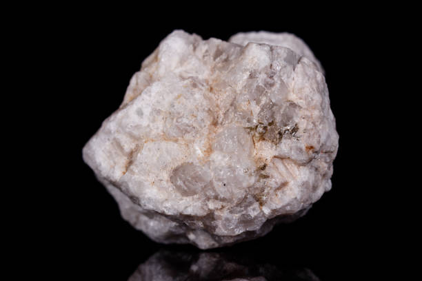 istock Macro mineral stone Albit on black background 1056721690