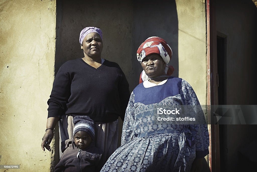 Township People A grainy lomofied image of a grandmother with her offspring in a African Township setting. Kwazulu-Natal Stock Photo