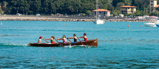 Lerici, La Spezia, Liguria, Italy, July 19, 2014: The female rowing team of Lerici trains in the waters of the Gulf of La Spezia for the Palio del Golfo. The \