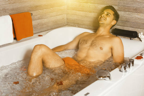 istock Man is relaxing after active day in hot tub 1056726282