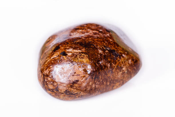 istock Macro mineral stone Bronze on white background 1056726436