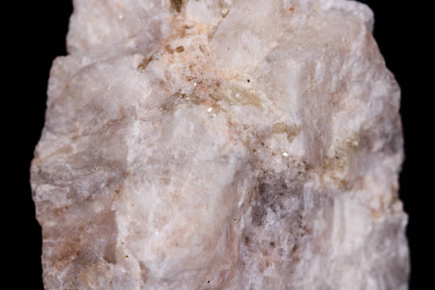 istock Macro mineral stone Wollastonite on black background 1056726510