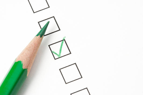 istock A green pencil that has been used to put a tick in a box 105672652