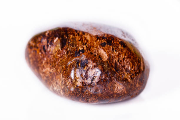 istock Macro mineral stone Bronze on white background 1056726734