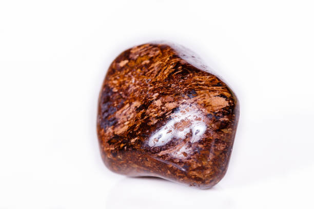 istock Macro mineral stone Bronze on white background 1056726834