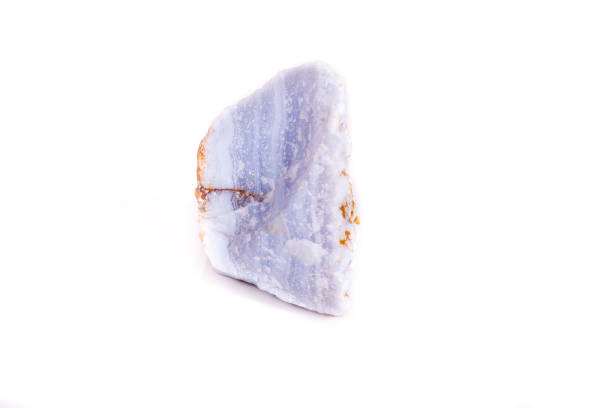 istock Macro mineral blue agate in the rock on white background 1056726902