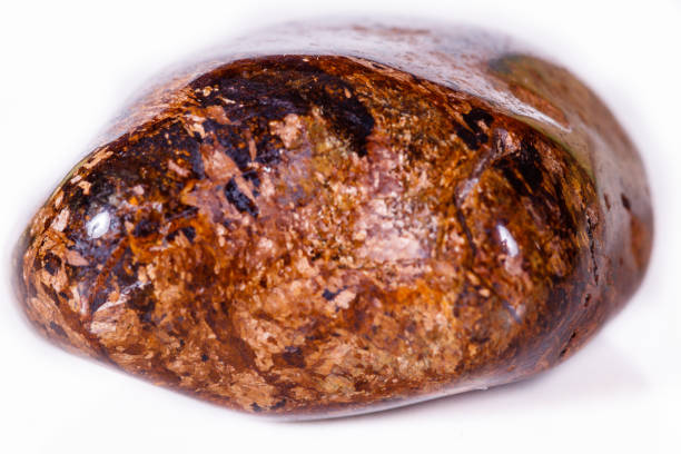 istock Macro mineral stone Bronze on white background 1056727006