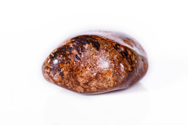 istock Macro mineral stone Bronze on white background 1056727906
