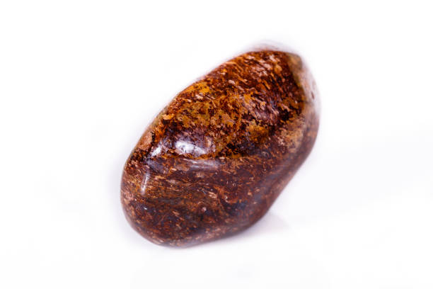 istock Macro mineral stone Bronze on white background 1056728426