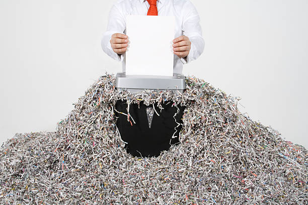 Businessman Shredding Documents Please see some similar pictures from my portfolio: sabotage stock pictures, royalty-free photos & images