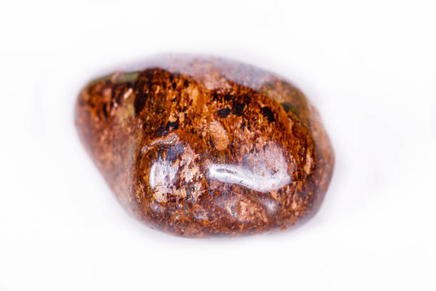 istock Macro mineral stone Bronze on white background 1056729860