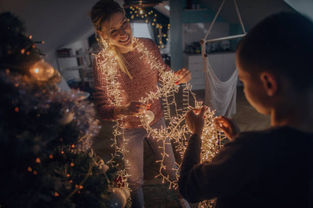 istock Mother and son preparing tangled string lights for Christmas 1056730662