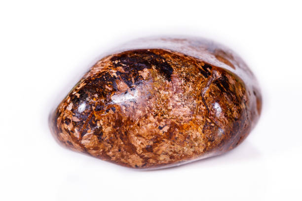istock Macro mineral stone Bronze on white background 1056730712