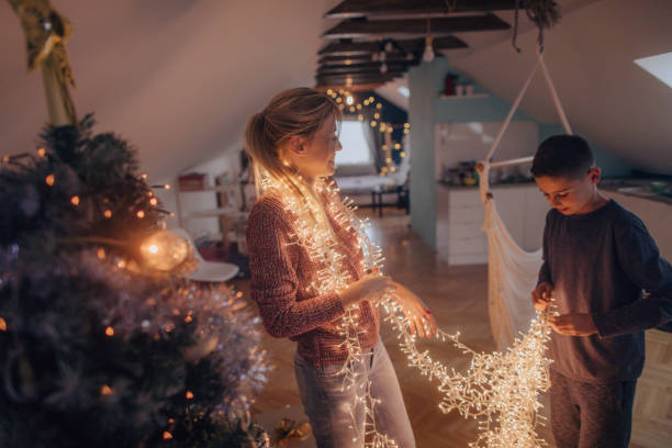 istock Mother and son preparing tangled string lights for Christmas 1056731142