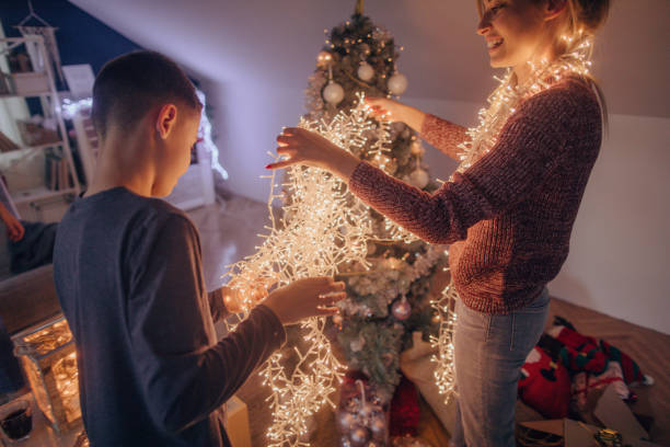 istock Mother and son preparing tangled string lights for Christmas 1056731838