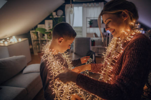 istock Mother and son preparing tangled string lights for Christmas 1056732206