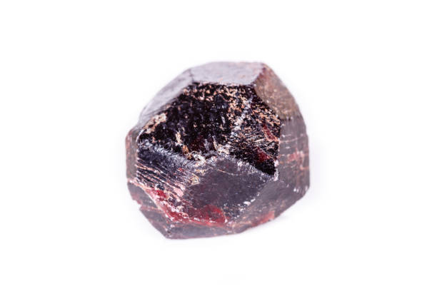 istock Macro of a mineral garnet stone on a white background 1056734384