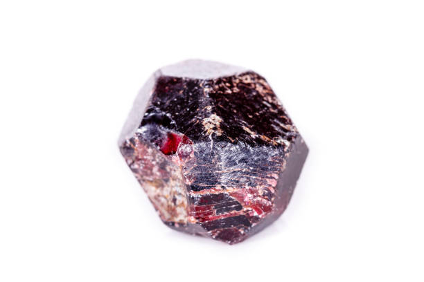 istock Macro of a mineral garnet stone on a white background 1056734822