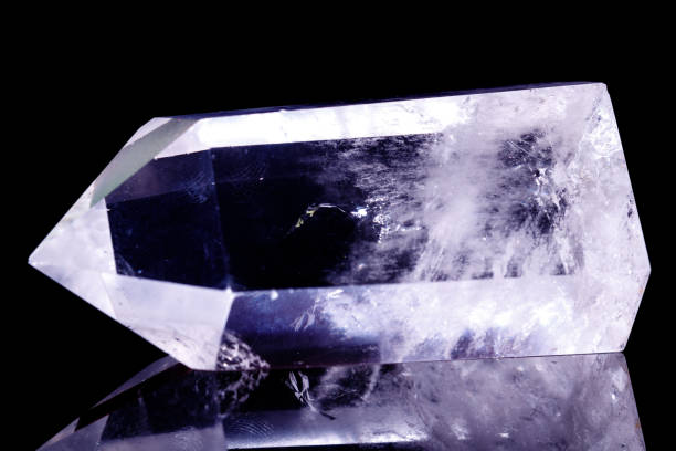 istock Macro mineral stone Crystal rock crystal on a black background 1056735232