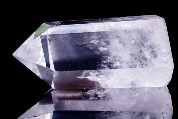 istock Macro mineral stone Crystal rock crystal on a black background 1056735272