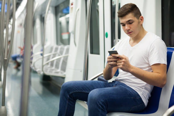 istock Man with luggage in underground carriage 1056738518